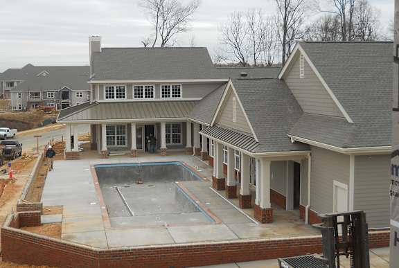 A house with a swimming pool in the backyard.