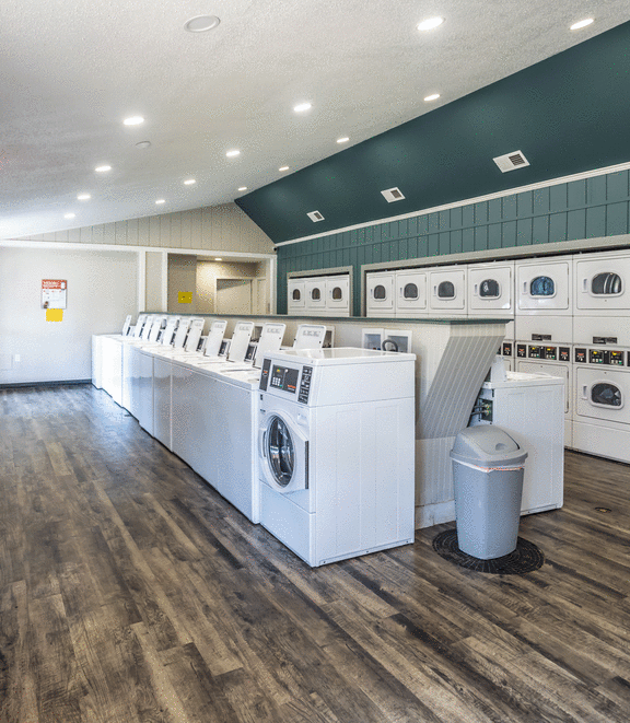the preserve at ballantyne commons laundry room with washers and dryers at Azure Place Apartments, Memphis, Tennessee