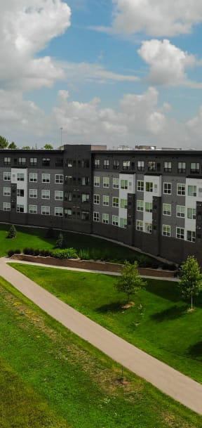 an aerial view of an apartment building on a cloudy day