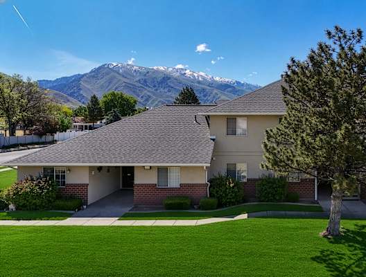 A house with a mountain in the background.