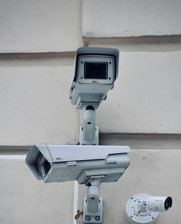 A security camera system is mounted on a building.