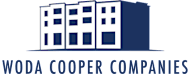 The image is a logo of Woda Cooper Companies featuring a building.