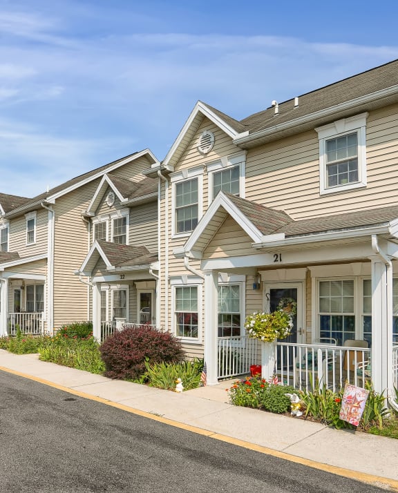 a row of houses on the side of a street