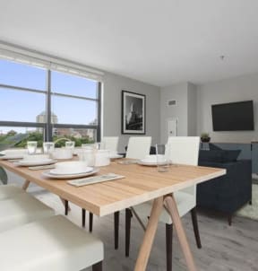 a dining room with a wooden table and chairs