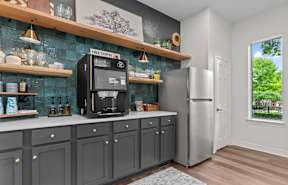 A kitchen with a coffee machine on the counter.