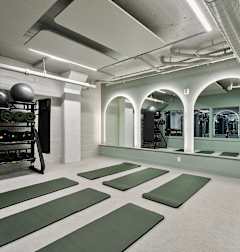 A yoga studio with grey mats on the floor at The Carousel, Richmond, 23220