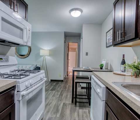 a kitchen and dining area in a 555 waverly unit