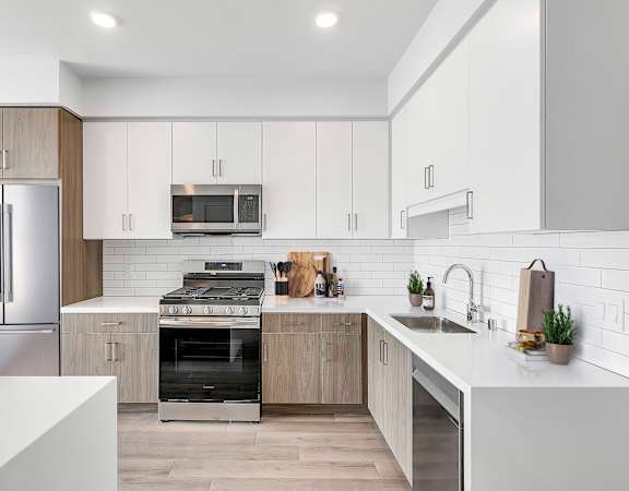a kitchen with a refrigerator and a counter top