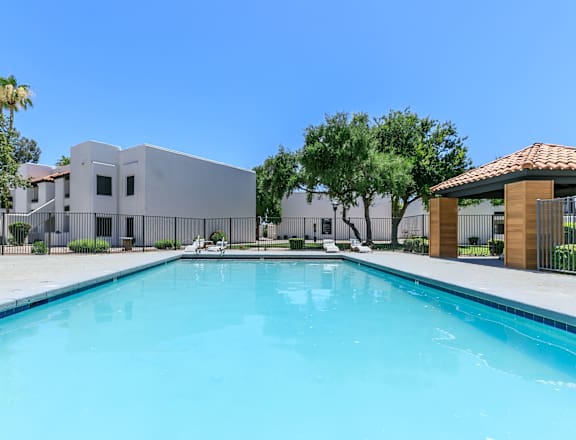 a large swimming pool with a building in the background at Tides at Mesa, Mesa, AZ, 85204