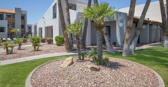a building with palm trees in front of it