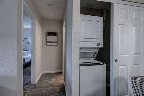 a room with a washer and dryer in it