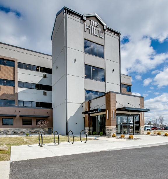 an office building with a blue sky in the background