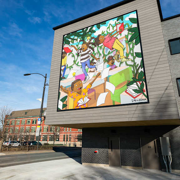 A large, colorful mural on the side of a building.
