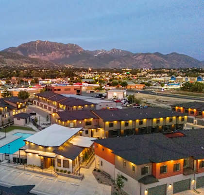 A residential area with houses and a swimming pool.