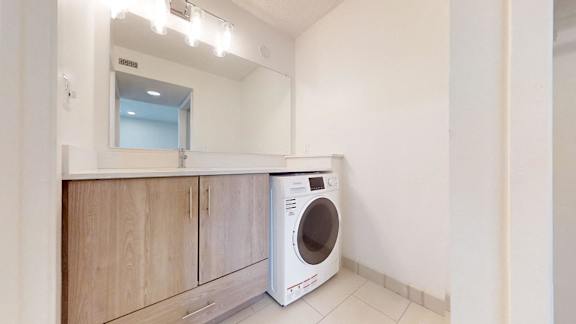 Bathroom with a dryer at Avia Lofts at Maple Road, New York, 14221