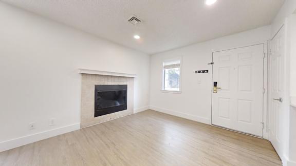 Room with a fireplace at Avia Lofts at Maple Road, Amherst, New York