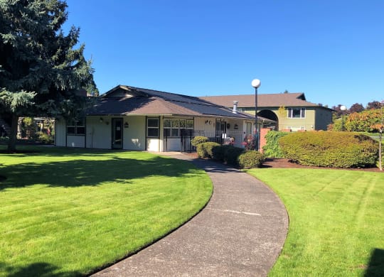 The Clairmont Apartments Building Exterior and Pathway with Landscaping