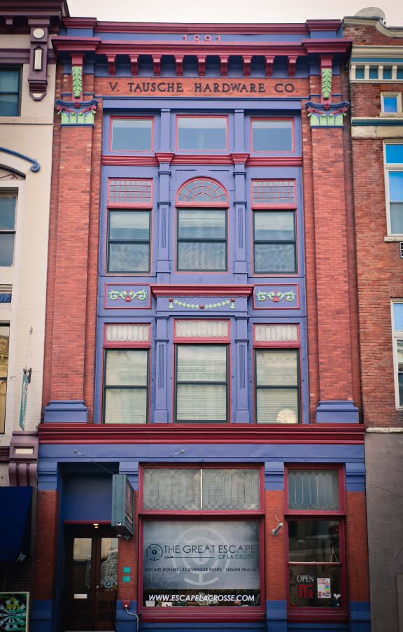 the front of a building with a purple facade
