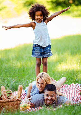Family playing in the park at Palm Park Apartments, Boynton Beach, FL