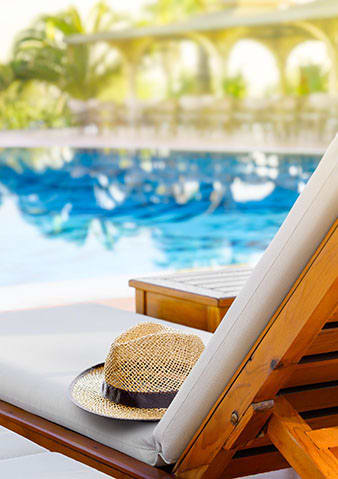 Lifestyle photo of lounge chair at the pool at Mariners Cove, Tampa, Florida