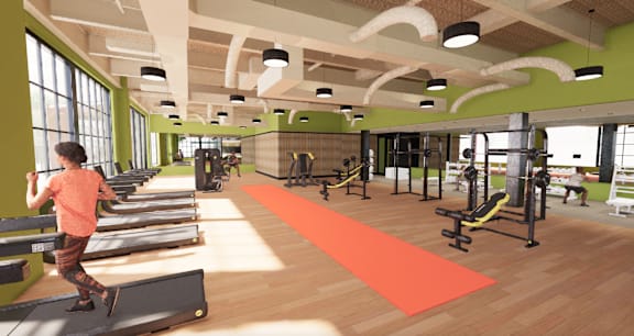 A woman is working out on a treadmill in a gym. at University Commons in Pittsburgh, PA