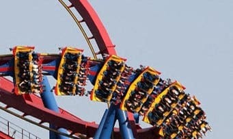 a roller coaster in a blue sky
