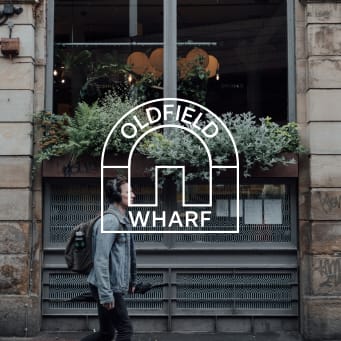 a man walking down the street in front of a window