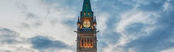 a large building with a tall tower with a clock on it