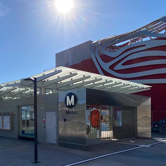 A sunny day at the metro station entrance.