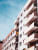 a large white building with many balconies