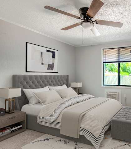 a furnished apartment bedroom at Mount Dora Apartments