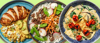 A variety of Asian dishes are displayed on a table.