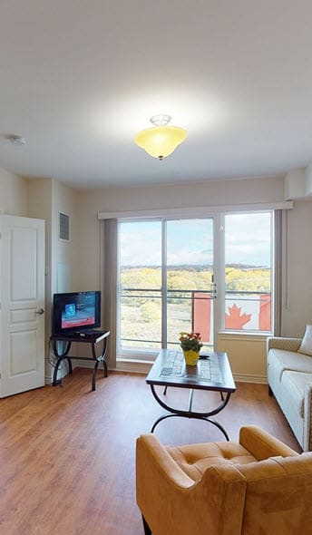 a living room with a couch a table and a tv