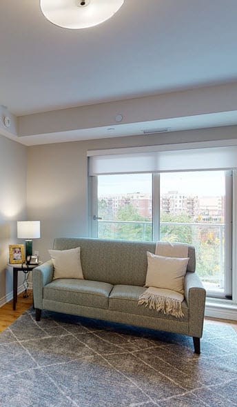 a living room with a couch and a window