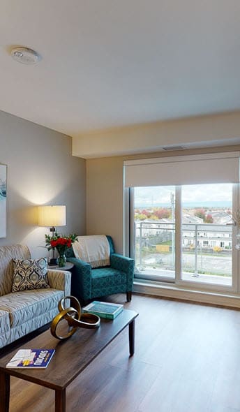 a living room filled with furniture and a large window