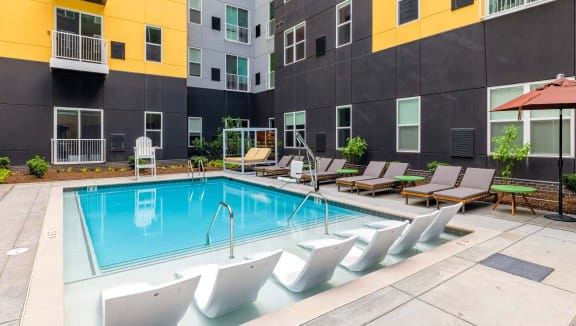 our apartments have a pool and lounge chairs