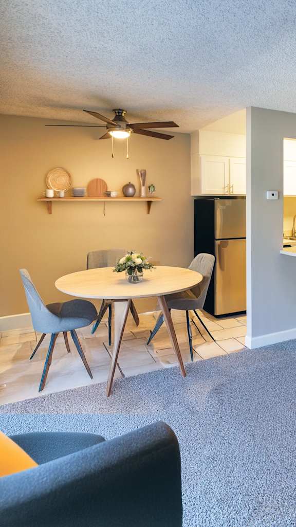 a living room with a bar and a kitchen