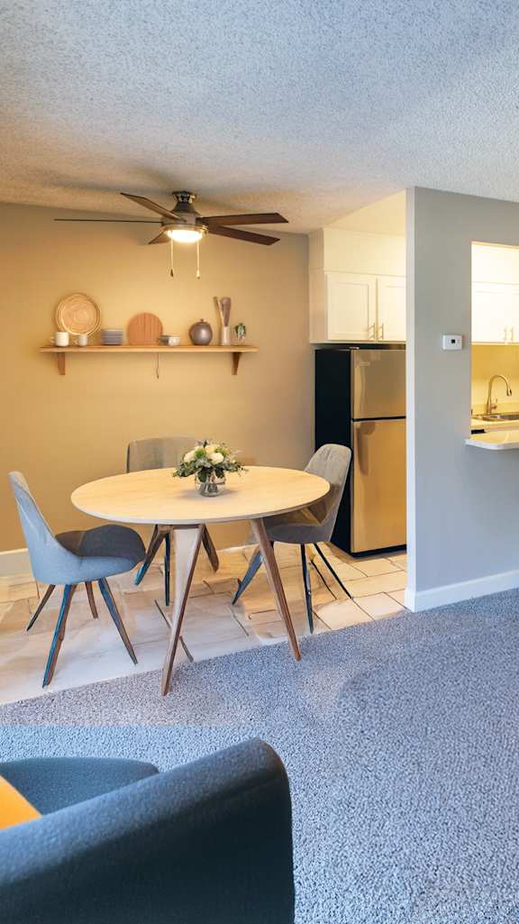 a living room with a bar and a kitchen