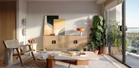 a living room with a large window and a wooden table