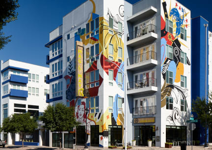 a building with graffiti on it on a city street