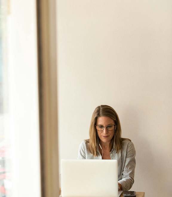 a woman working on a laptop at Nook at Northaven Apartments, Washington, 98125