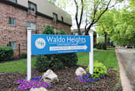 a sign for waldo heights in front of a brick building at Waldo Heights, Kansas City, 64131