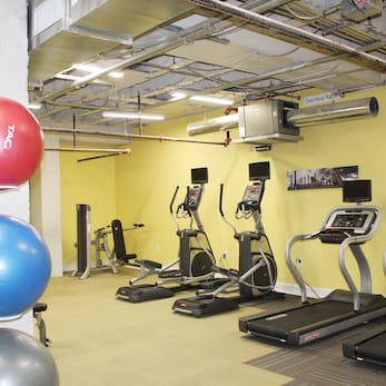 Fitness Center with cardio and strength equipment and yoga balls