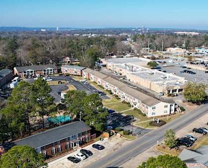 an aerial view of a city with buildings and trees