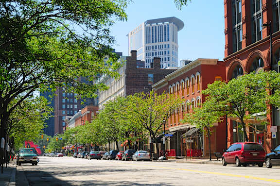 A city street with cars and buildings.