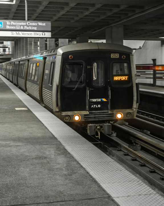 A train with the number 2521 on it is at the platform.