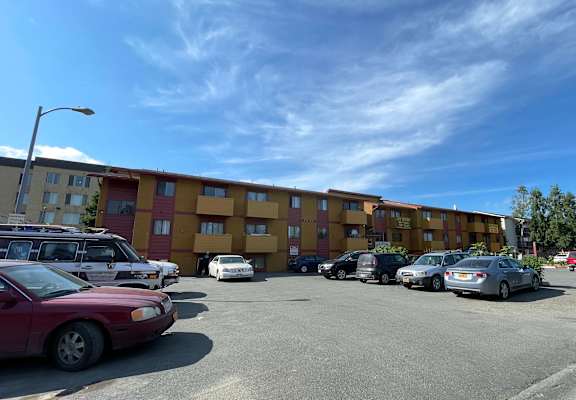 an empty parking lot in front of an apartment building at Nicole Apartments, Anchorage, AK