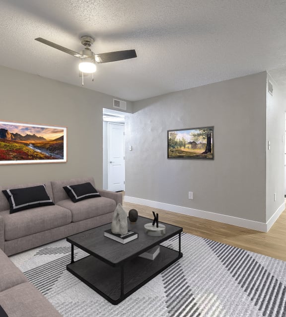 a living room with some chairs and a carpet