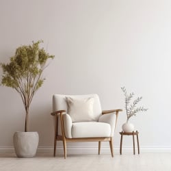 a living room with a white chair and a plant