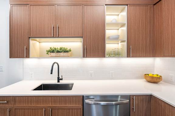 A kitchen with a sink and a dishwasher.at Essen Apartments, Alexandria, VA